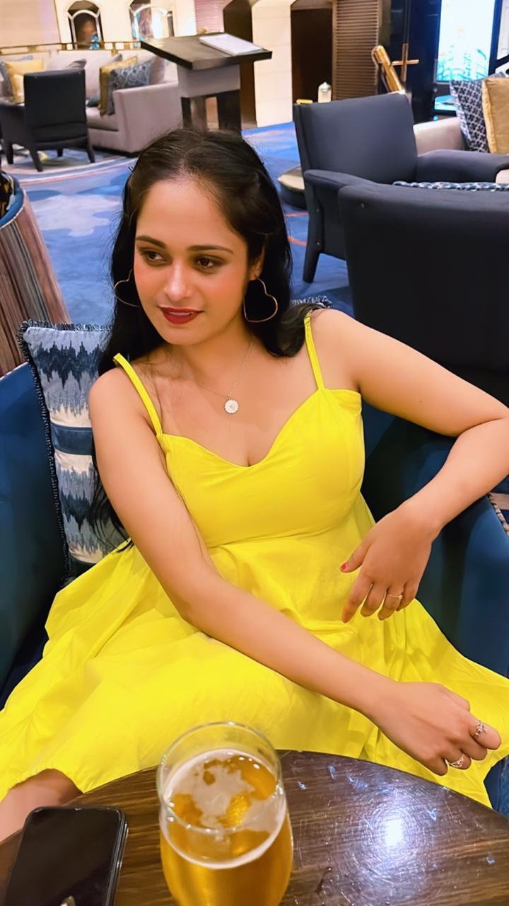 Ritu Rai in yellow dress at event