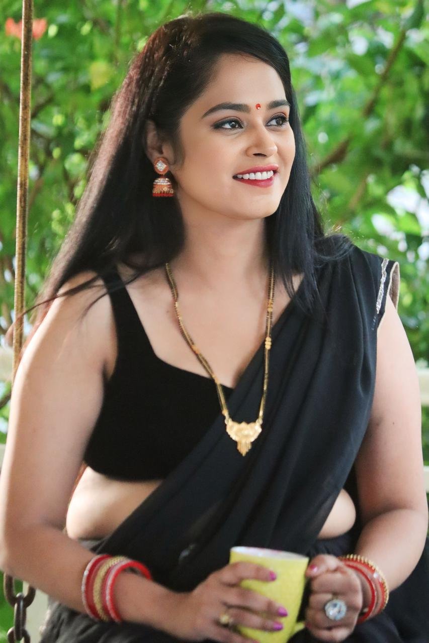 Ritu Rai laughing in black saree